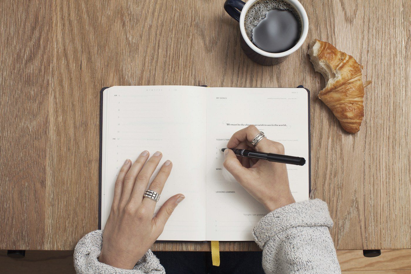 Open notebook beside a computer